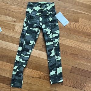 Never worn Lululemon Fast and Free HR Crop 23”.